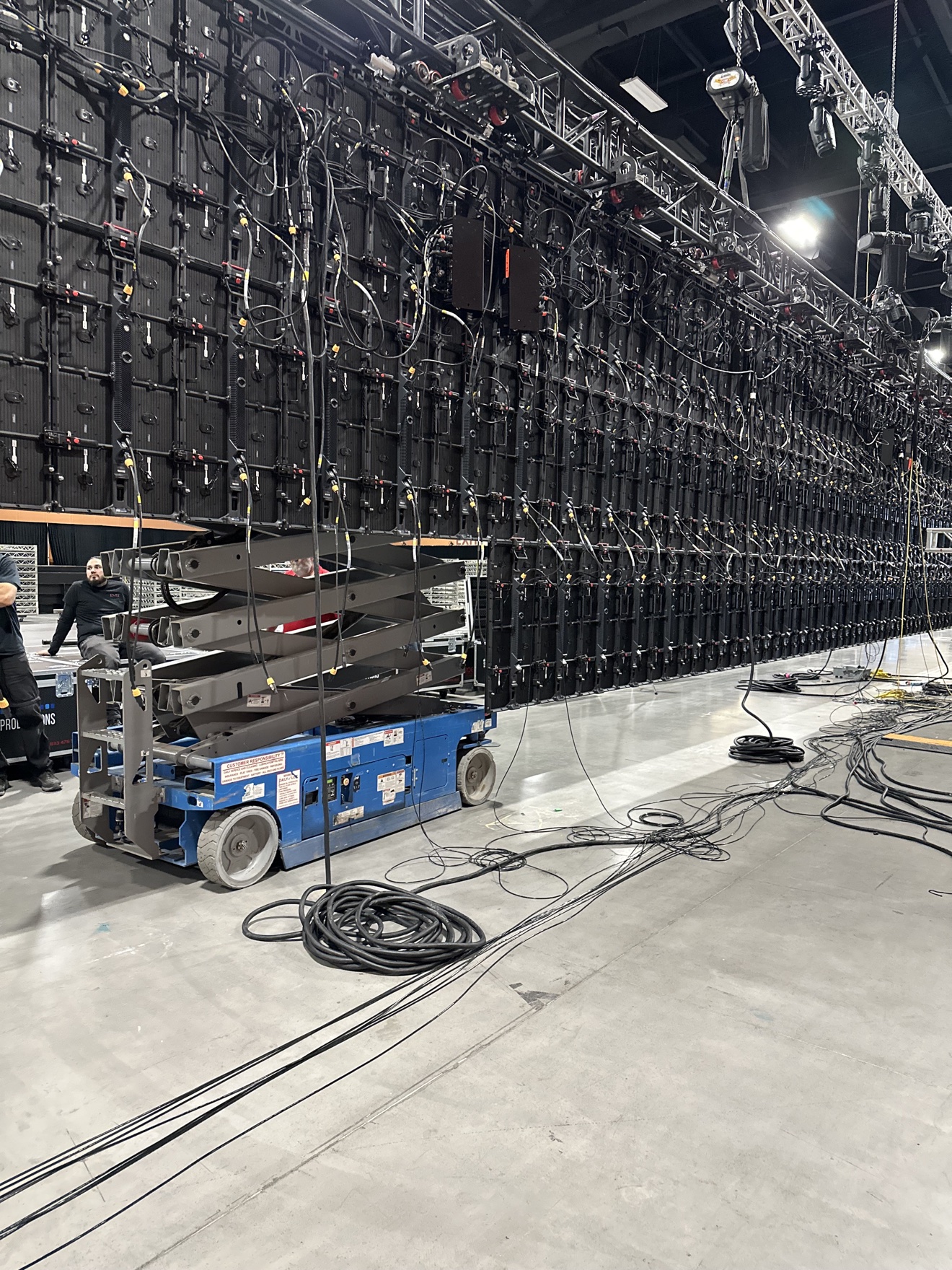 LED video wall load-in with a scissor lift and production equipment
