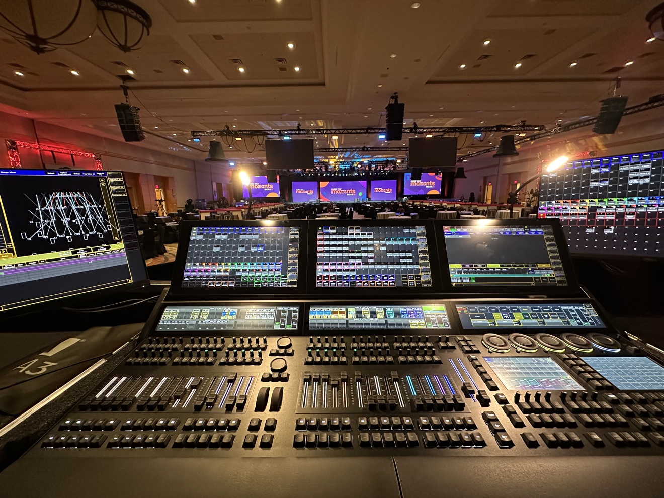 Lighting console at front of house during a live event