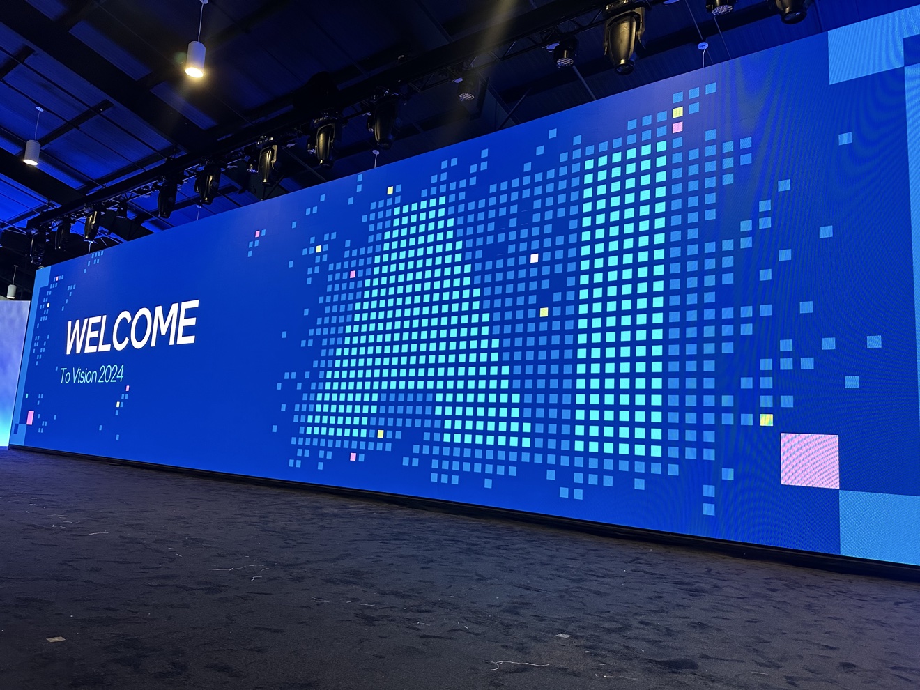 Vision 2024 event welcome graphics displayed across an LED wall