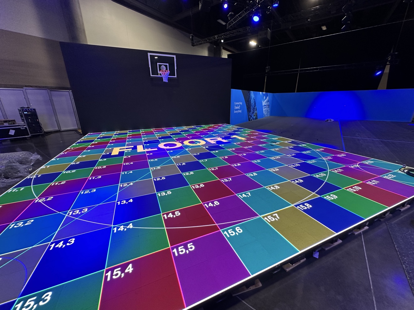 Illuminated LED basketball court floor inside a live event venue