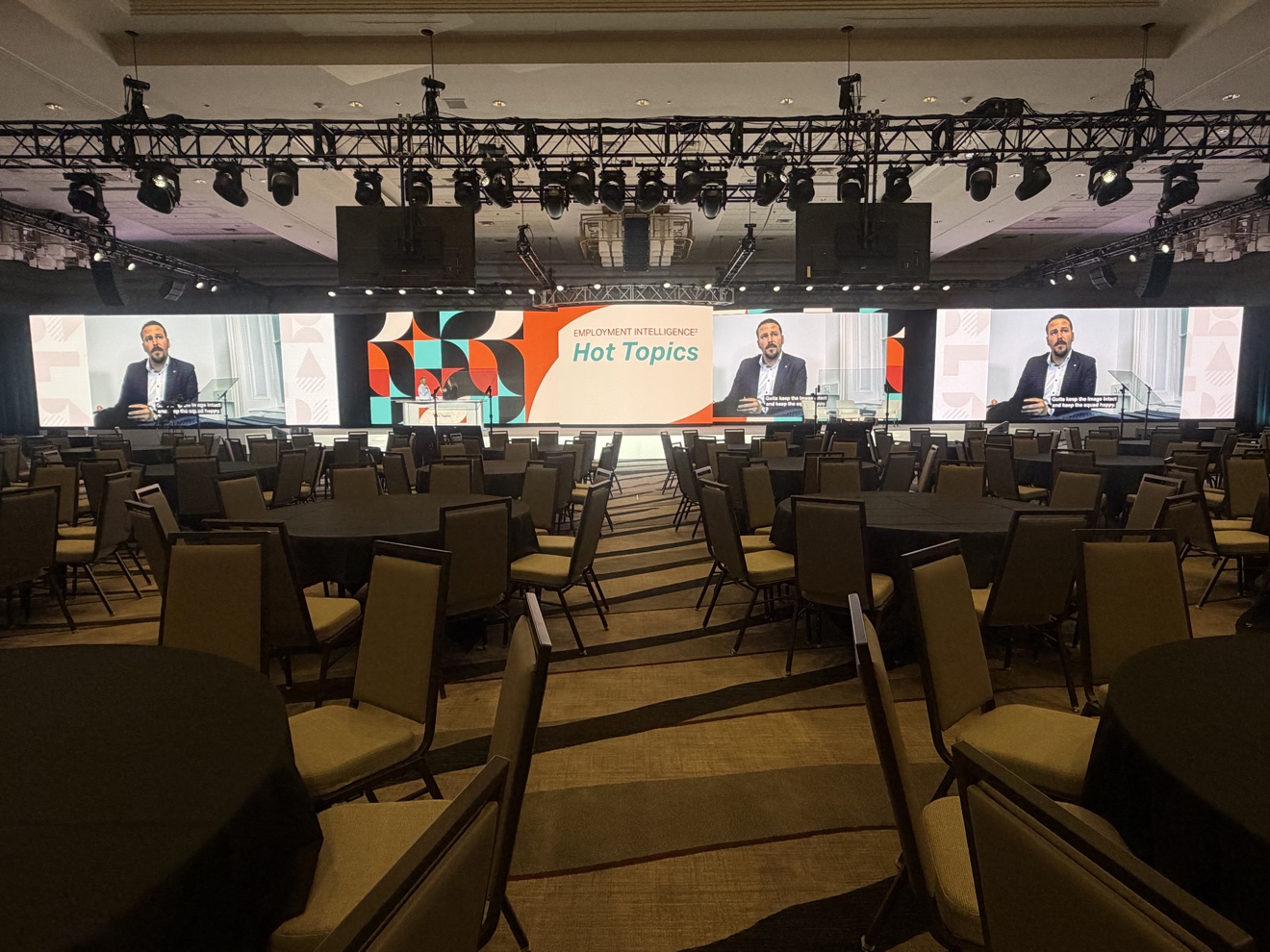 Corporate general session stage with multiple LED screens